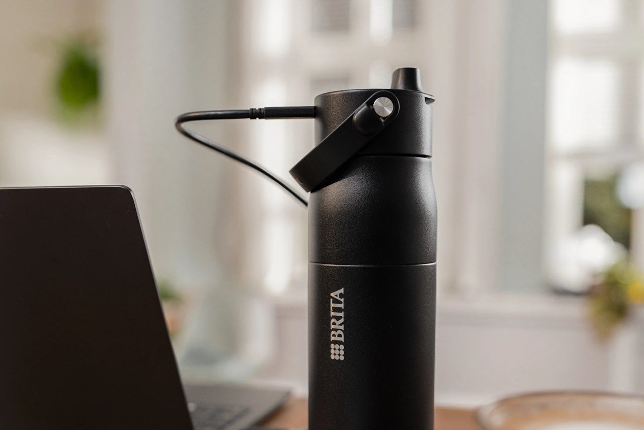 Black BRITA LARQ Bottle charging with USB charging cable