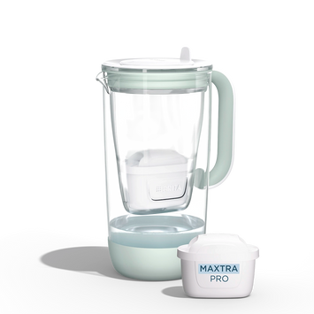 A water filter glass jug in green  on a white background
