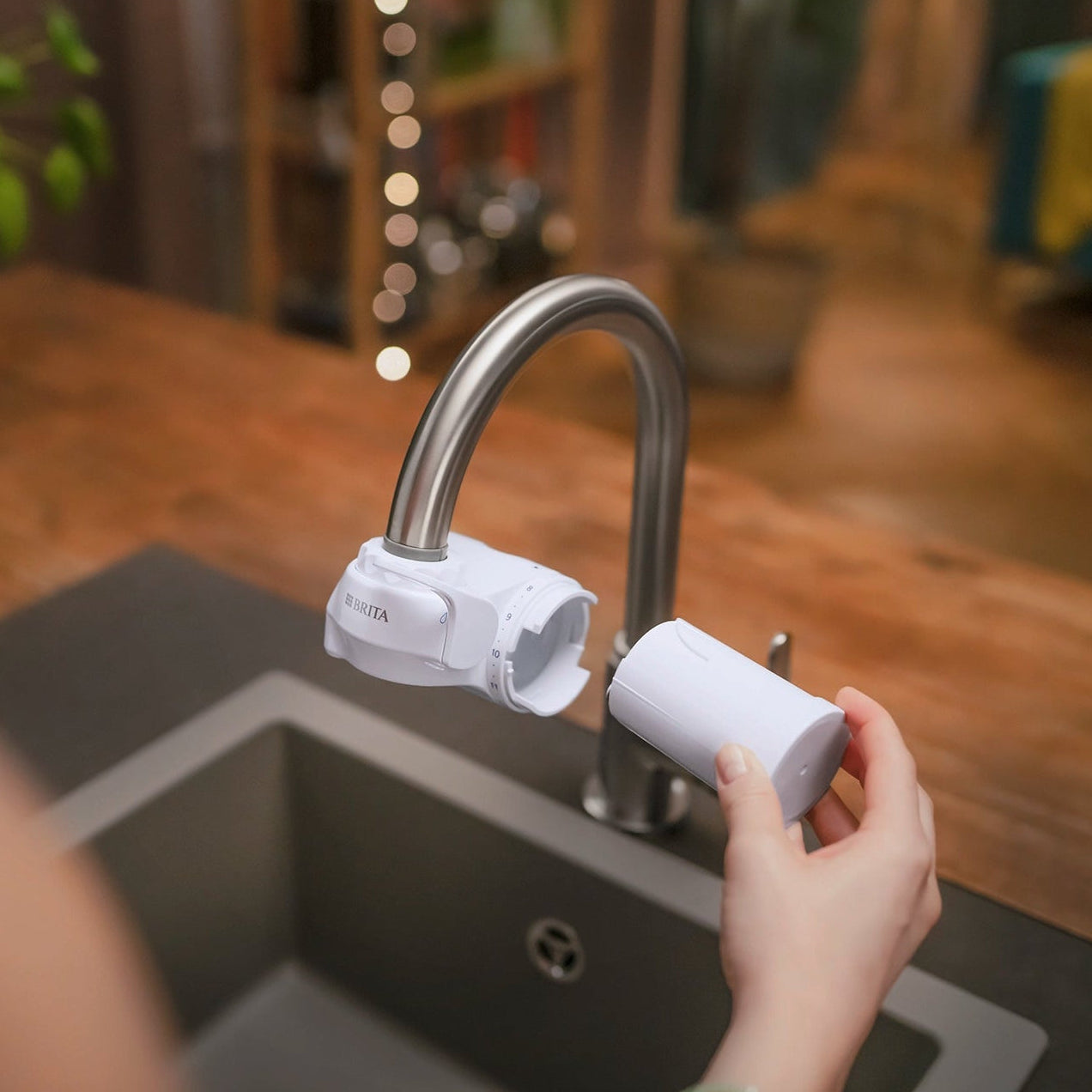 Replacing the filter cartridge in a BRITA ON TAP water filter system